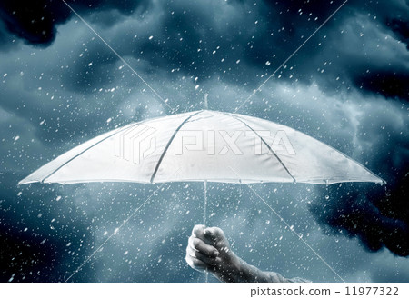 Umbrella in hand under raindrops Umbrella in hand under raindrops 11977322