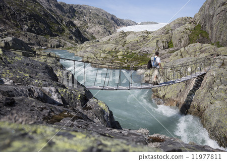 Bridge over waterfall near Svelgabreen glacier (Hordaland county 11977811