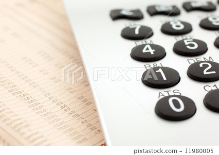 financial newspaper with calculator financial newspaper with calculator 11980005