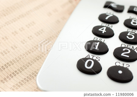 financial newspaper with calculator financial newspaper with calculator 11980006