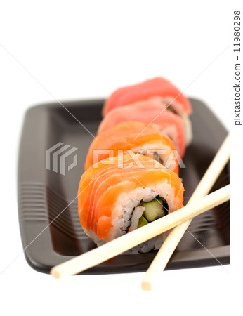 four rolls on a black plate four rolls on a black plate 11980298