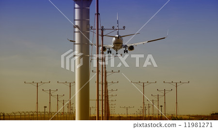 Airplane approaching for Touchdown at sunset 11981271