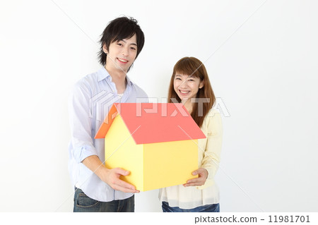 Home and young couple 11981701
