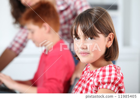 Closeup of young girl in classroom 11985405