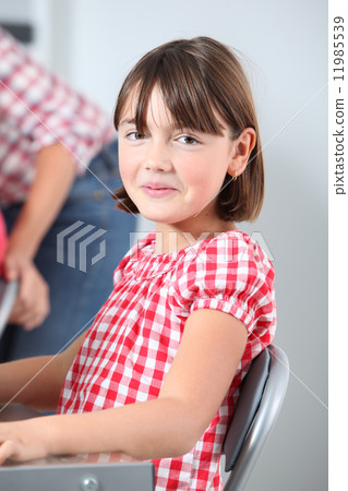 Closeup of young girl in classroom 11985539