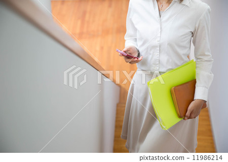 A woman walking up the stairs 11986214