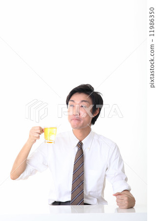 A beverage drinking office worker 11986350