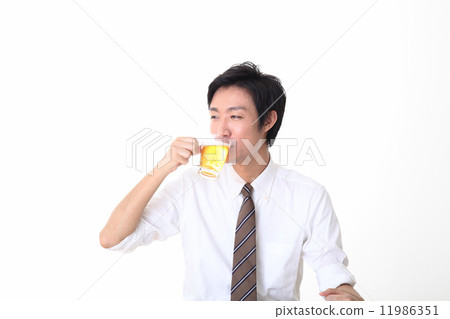 A beverage drinking office worker 11986351