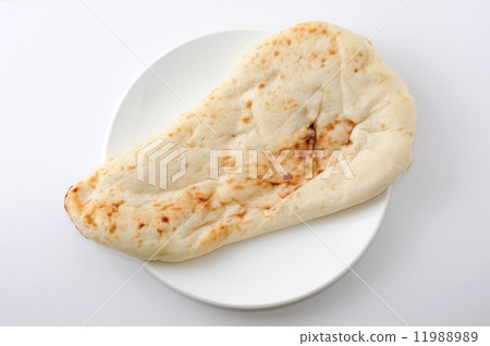 Nan Indian food bread white dish on dish Nan Indian food bread white dish on dish 11988989