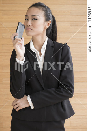 Asian Business Woman Indoor with mobile telephone 11989324