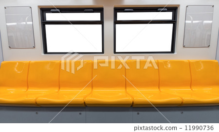 Yellow chair and windows in electric train 11990736