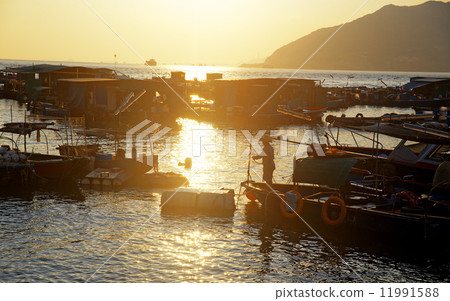 sunset at fishing village 11991588