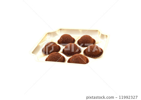 seven truffles in an open box 11992327