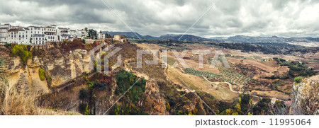 Panoramic view of old city of Ronda and surrounding countryside. 11995064