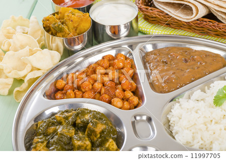 Thali - South Asian selection of vegetarian curries and rice served in a traditional dish. 11997705