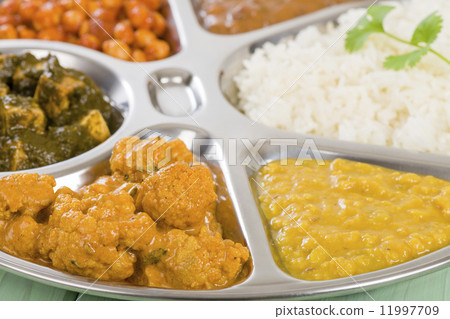 Thali - South Asian selection of vegetarian curries and rice served in a traditional dish. 11997709