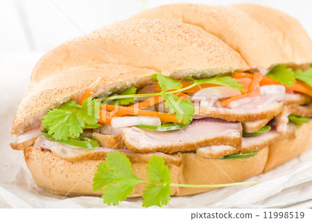 Banh Mi - Crusty bread filled with smoked duck breast slices, carrot and daikon radish pickle. Banh Mi - Crusty bread filled with smoked duck breast slices, carrot and daikon radish pickle. 11998519