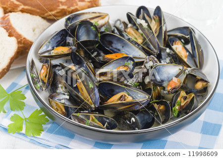 Moules Marinieres - Mussels cooked with white wine sauce. Moules Marinieres - Mussels cooked with white wine sauce. 11998609
