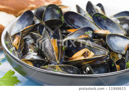 Moules Marinieres - Mussels cooked with white wine sauce. Moules Marinieres - Mussels cooked with white wine sauce. 11998615
