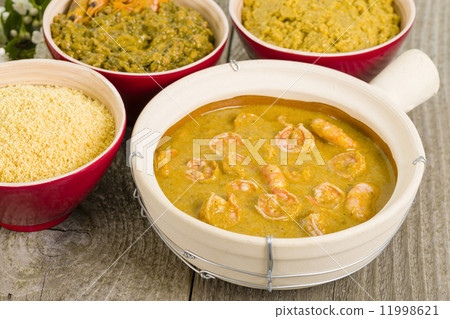 Moqueca de Camarao - Brazilian prawns in coconut milk and dende oil. Food from Bahia. 11998621