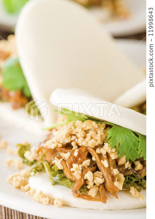 Gua Bao - Taiwanese sandwich of braised pork belly with pickled mustard greens and coriander 11998643