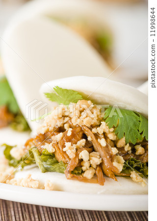 Gua Bao - Taiwanese sandwich of braised pork belly with pickled mustard greens and coriander 11998644