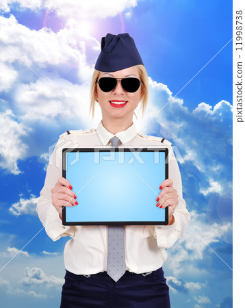 Flight attendant holding touch pad 11998738