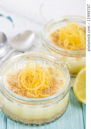 Lemon Cheesecake - Individual lemon cheesecakes with a biscuit base. Lemon Cheesecake - Individual lemon cheesecakes with a biscuit base. 11998787