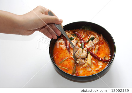 chicken tomyum the favourite spicy food in thailand with spoon a 12002389