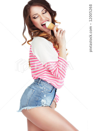 Alluring Elated Woman Licking Delicious Ice Cream 12005268