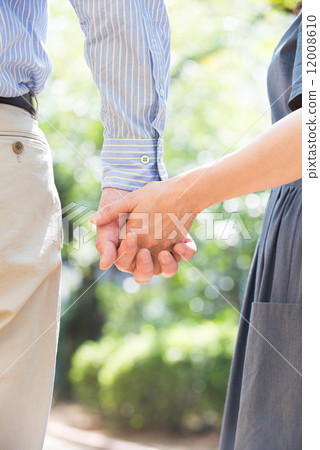 Middle couple holding hands Middle couple holding hands 12008610