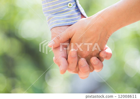 Middle couple holding hands 12008611