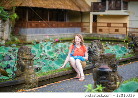 Tourist in Pura Saraswati temple in Ubud Tourist in Pura Saraswati temple in Ubud 12010339
