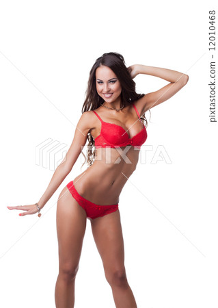 Studio shot of happy skinny woman in red lingerie Studio shot of happy skinny woman in red lingerie 12010468