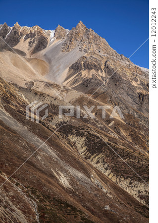 High steep wall in Annapurna region mountains, Himalayas, Nepal. 12012243