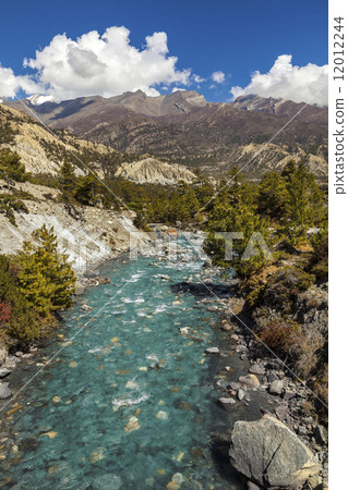 Mountain river in Himalayas, Annapurna Circuit trail in Nepal. Mountain river in Himalayas, Annapurna Circuit trail in Nepal. 12012244