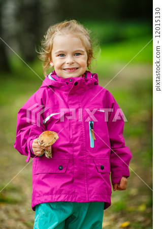 Happy little girl with a mushroom Happy little girl with a mushroom 12015130