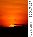 Sunset behind the clouds in the evening. 12017127