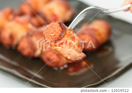 fried sausage rolled with bacon fried sausage rolled with bacon 12019522