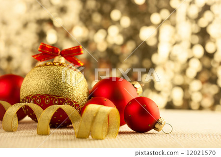 Christmas Bright red baubles with golden ribbons Christmas Bright red baubles with golden ribbons 12021570