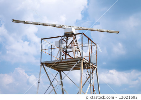 Radar station tower above blue cloudy sky 12021692