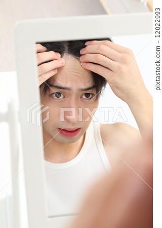 Young men who care about their hairline 12022993