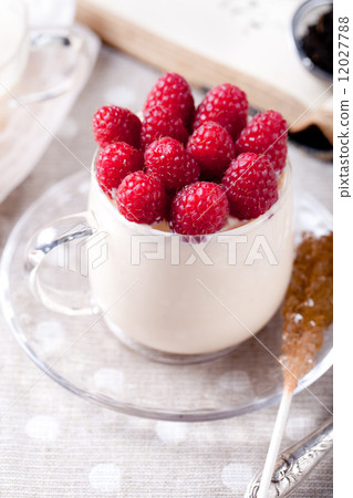 Yogurt with fresh raspberries, bread, tea Yogurt with fresh raspberries, bread, tea 12027788