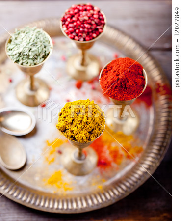 Various Indian spices in vintage metal cups Various Indian spices in vintage metal cups 12027849