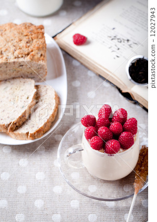 Yogurt with fresh raspberries, bread, tea Yogurt with fresh raspberries, bread, tea 12027943