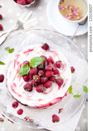 Raspberry, rose cheesecake with a cup of tea Raspberry, rose cheesecake with a cup of tea 12028007