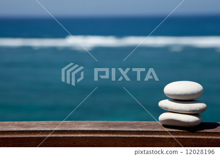 Stack of pebble stones at the beach Stack of pebble stones at the beach 12028196