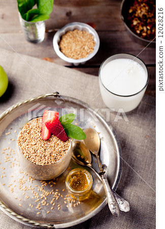 Flax seeds, oat pudding in a glass with berries Flax seeds, oat pudding in a glass with berries 12028216