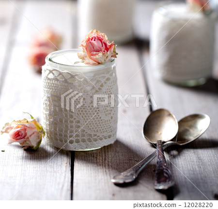 Rose flavor Greek yogurt in a glass jarwith lace 12028220