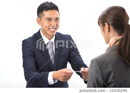 Japanese men handing business cards 12030299